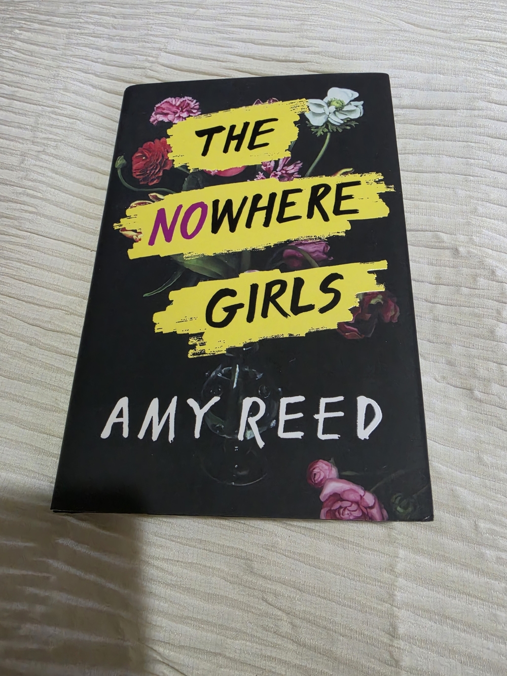 The Nowhere Girls by Amy Reed - Black Cover with Yellow & Pink Accents